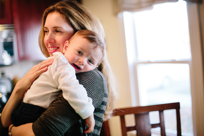baby boy laying on moms shoulder snuggling
