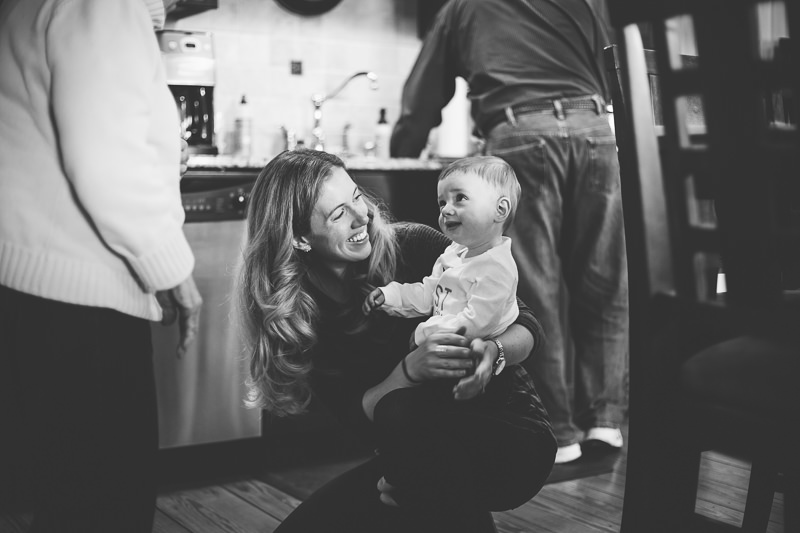 baby boy finds mom in kitchen