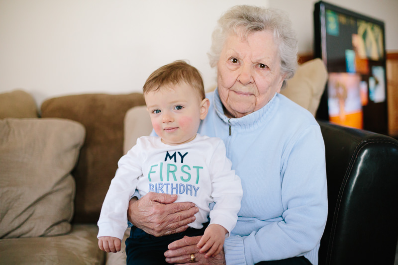 birthday baby boy sits with grandma