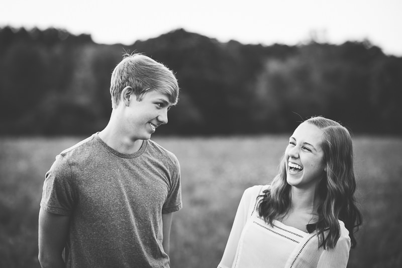 brother and sister laughing at each other