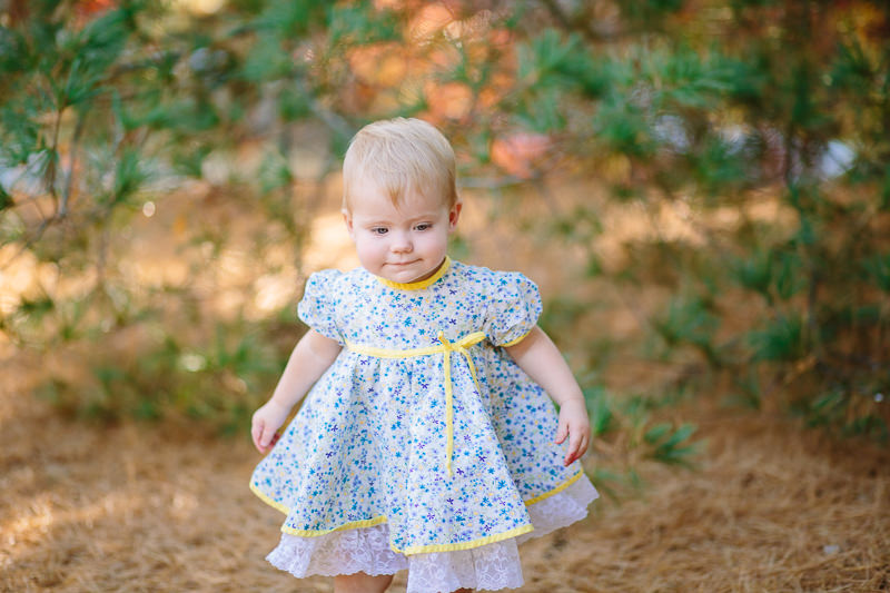 baby girl in blue flower dress