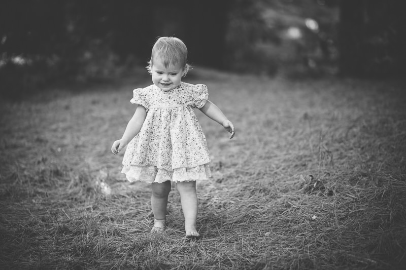 baby girl walking outside in dress