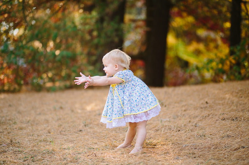 baby girl holding out hands reaching