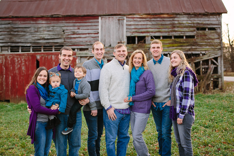 extended family wearing purple teal and grey