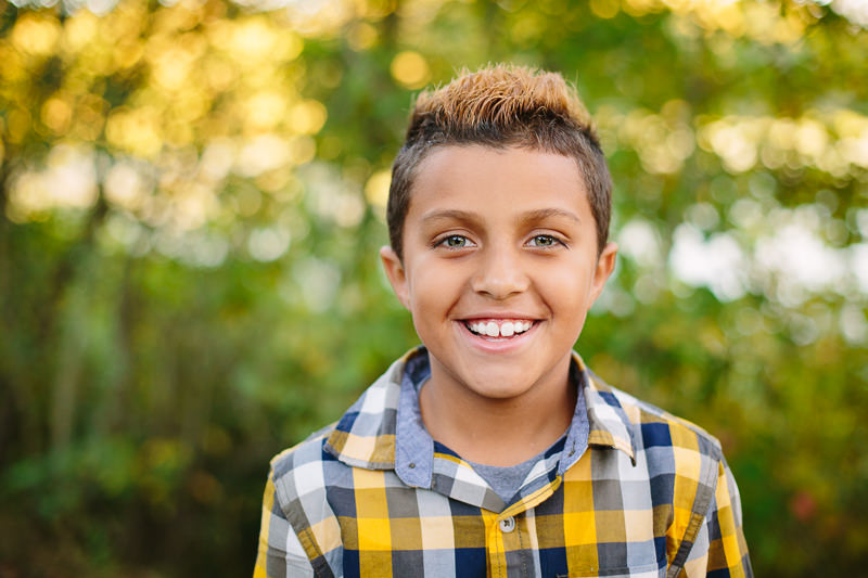 young boy with yellow plaid shirt