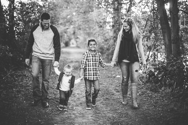family walking and holding hands two kids