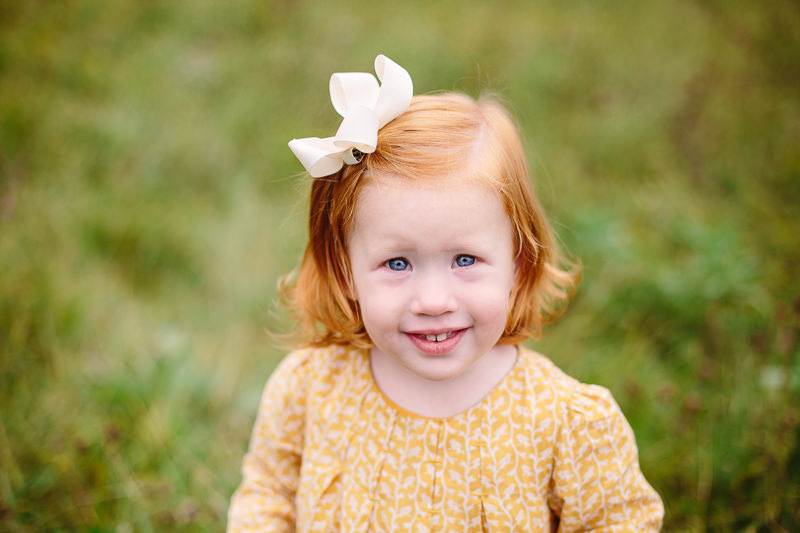 toddler girl with red hair and yellow dress