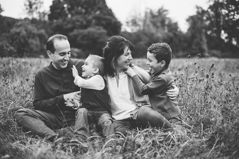 family laughing and tickling each other