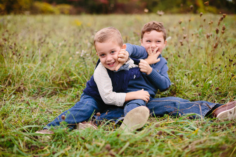 brothers wrestling outside in a field
