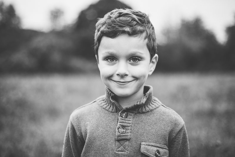 black and white portrait of boy in a sweater
