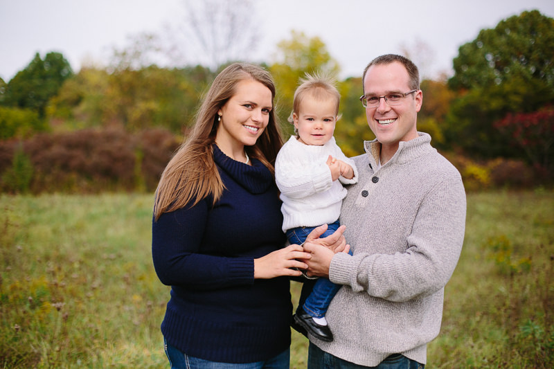 Young family wearing sweaters