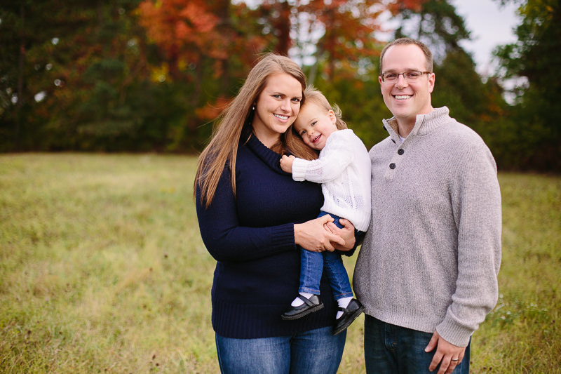baby snuggling with mom and dad