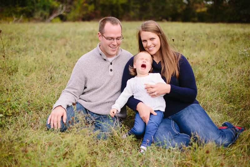toddler crying on moms lap