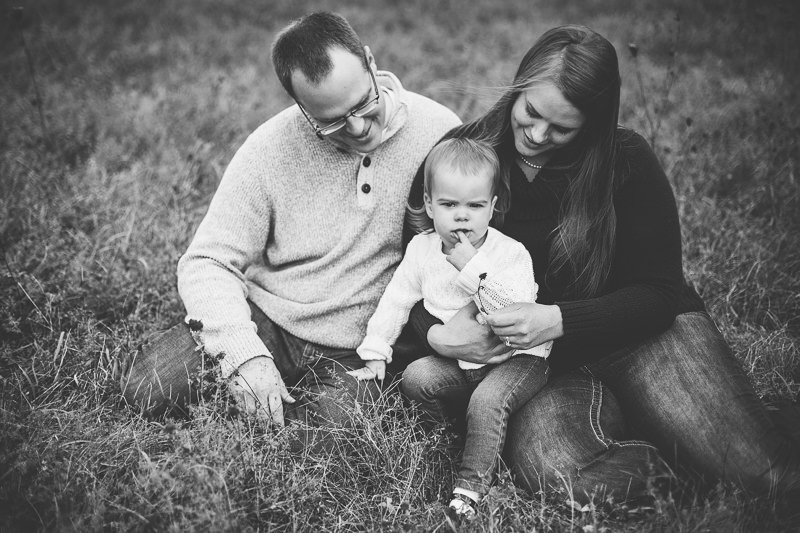 mom and dad looking at baby girl
