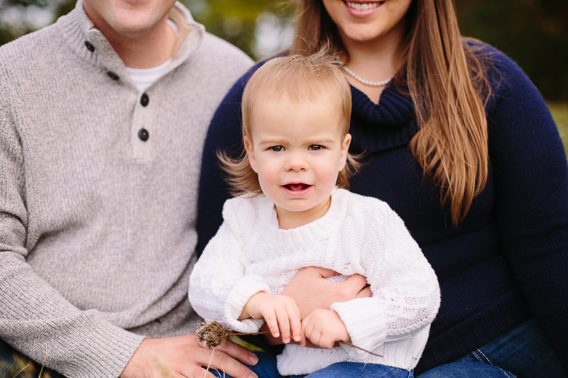 baby girl in white sweater