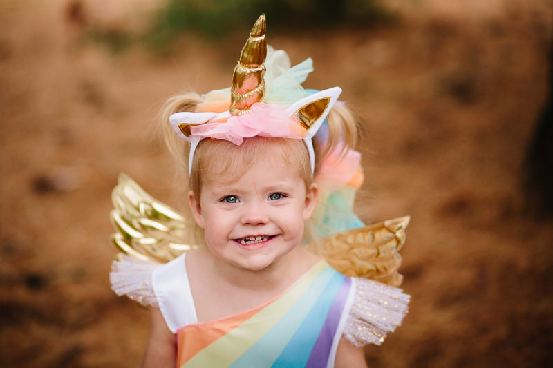 toddler girl wearing unicorn halloween costume