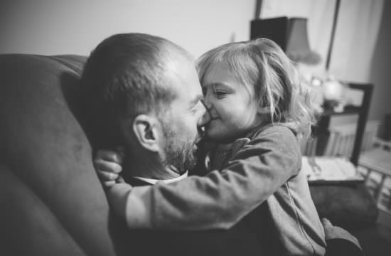 toddler kissing dad on the nose