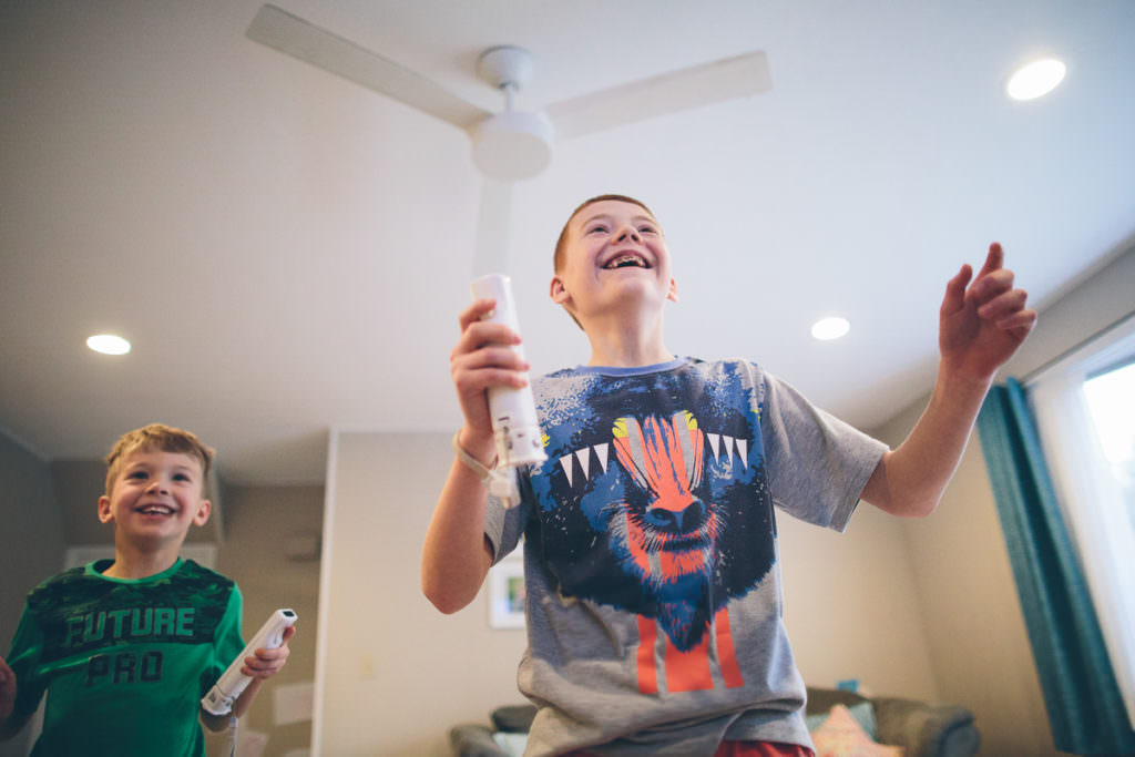 two boys playing the wii