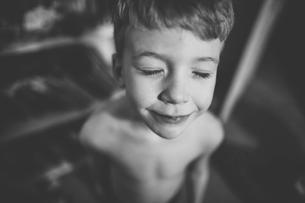 black and white boy with eyes closed