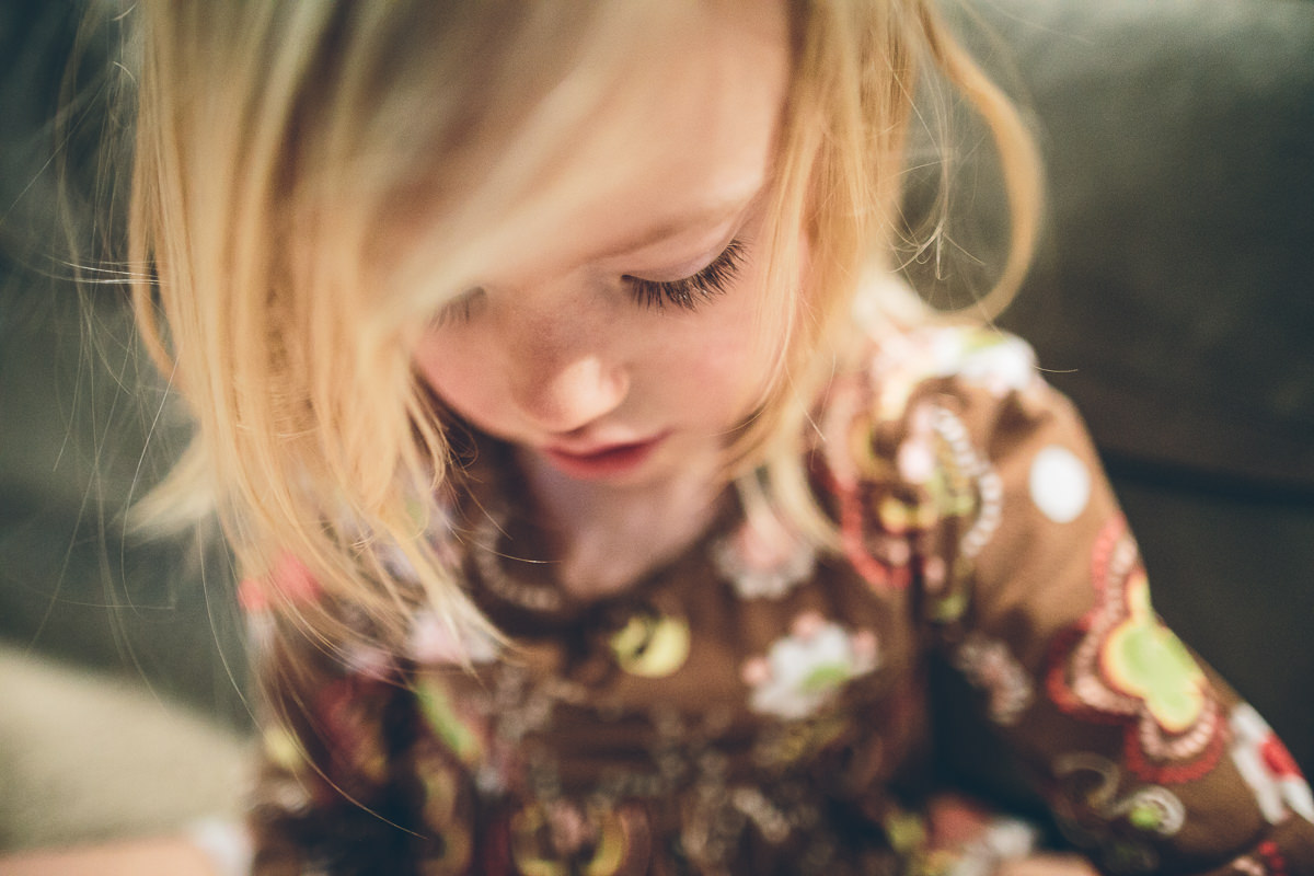 little girl looking down with long eyelashes