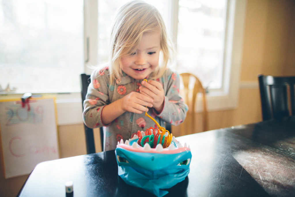 little girl playing shark bite game