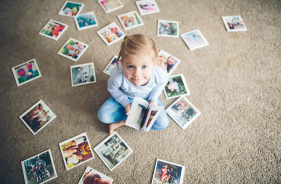 little girl looking at chatbooks