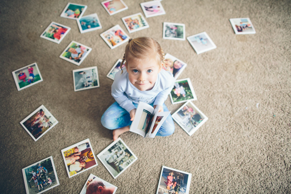 little girl looking at chatbooks