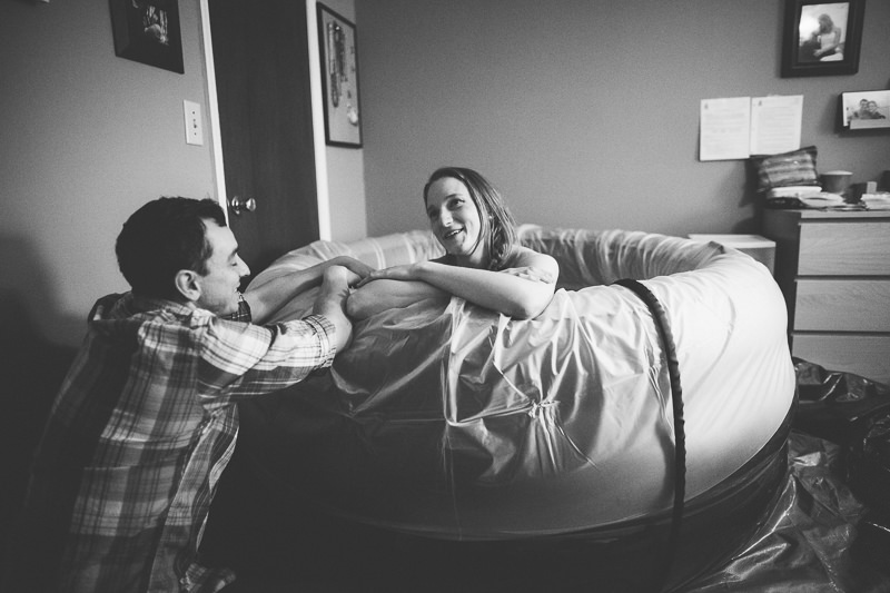 mom in birth tub talking to husband