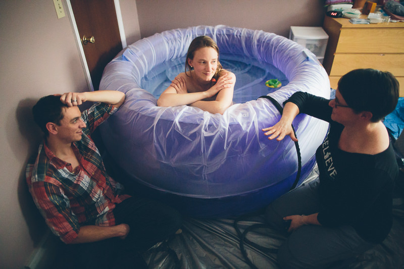 talking to doula and husband in birth tub
