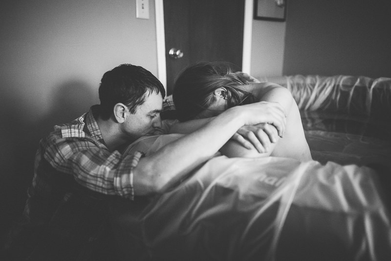 husband supporting wife in labor