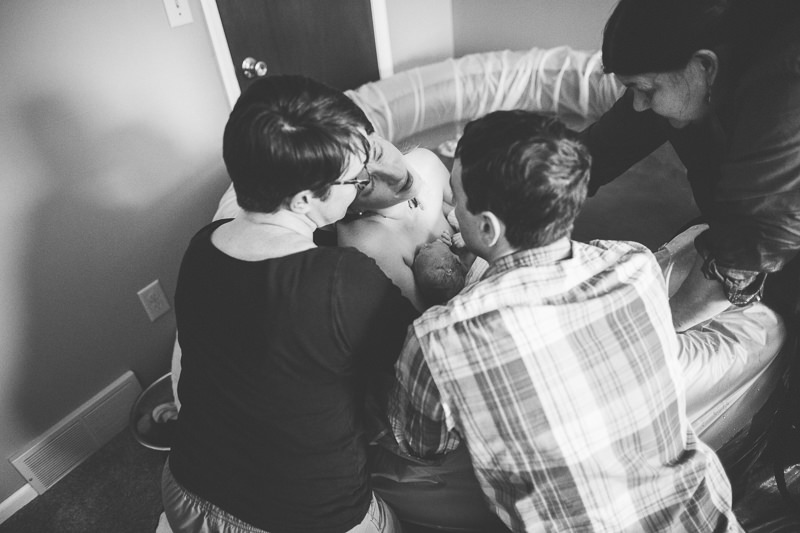 resting head on doula after baby born