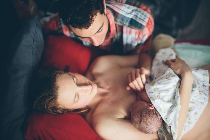 down view mom and dad with new baby