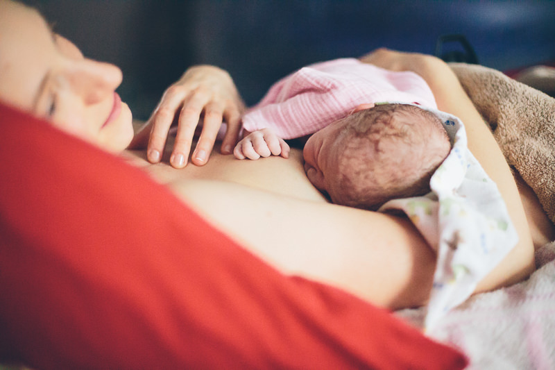 mom and newborn baby girl hands
