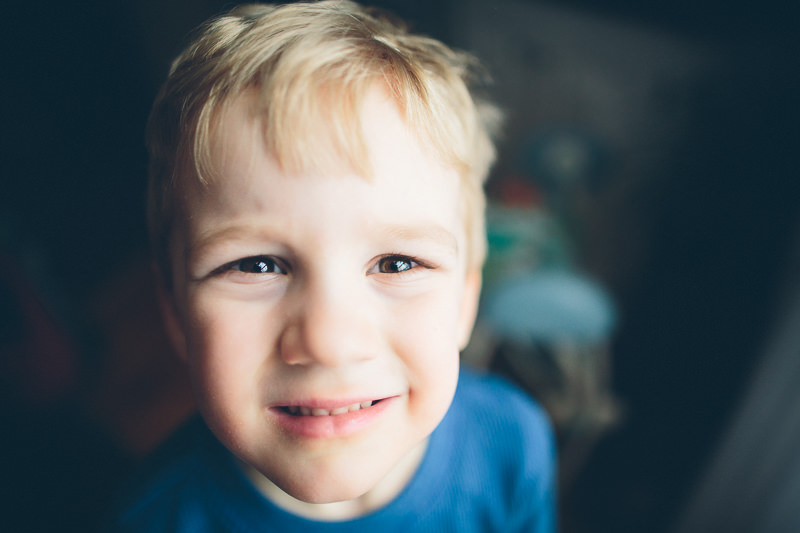 blond hair boy with blue shirt