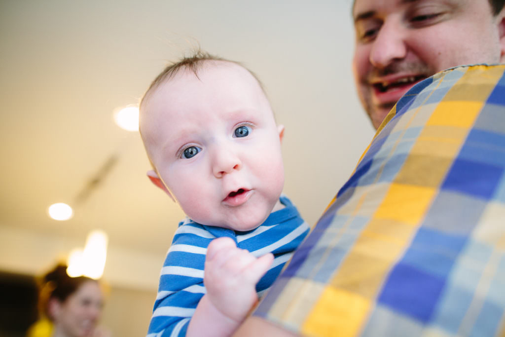 baby boy with blue eyes and blue shirt