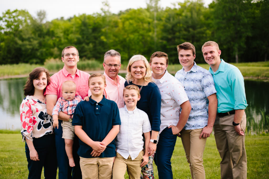 family picture near pond at apple orchard
