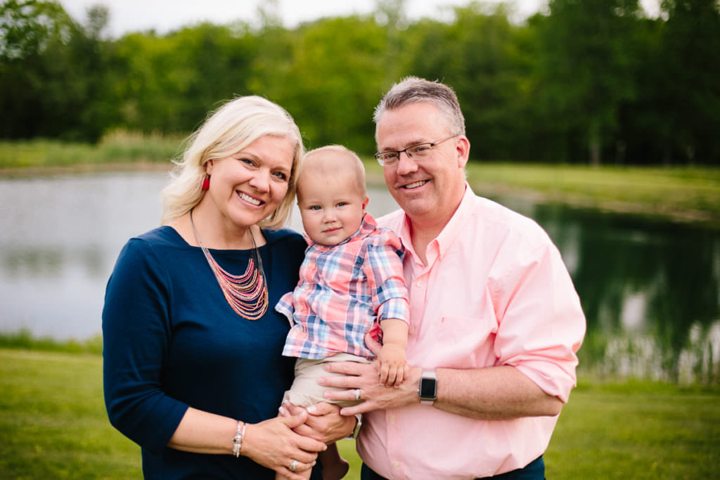 grandparents holding grandson