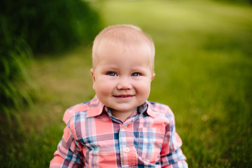 toddler boy with blue eyes and plaid shirt