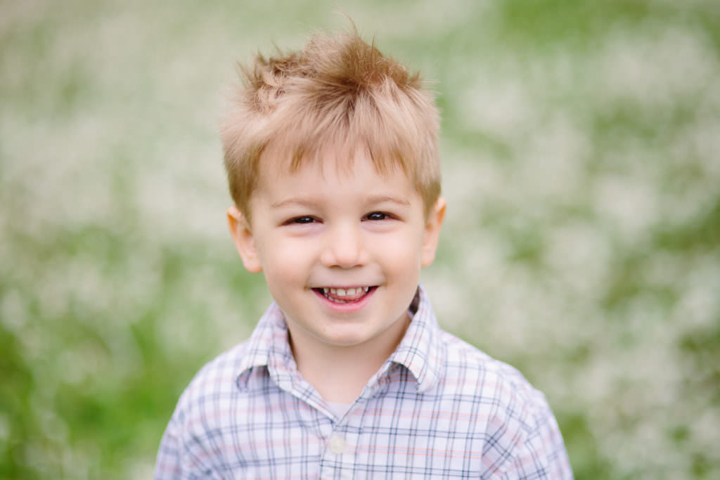 brown hair little boy in field