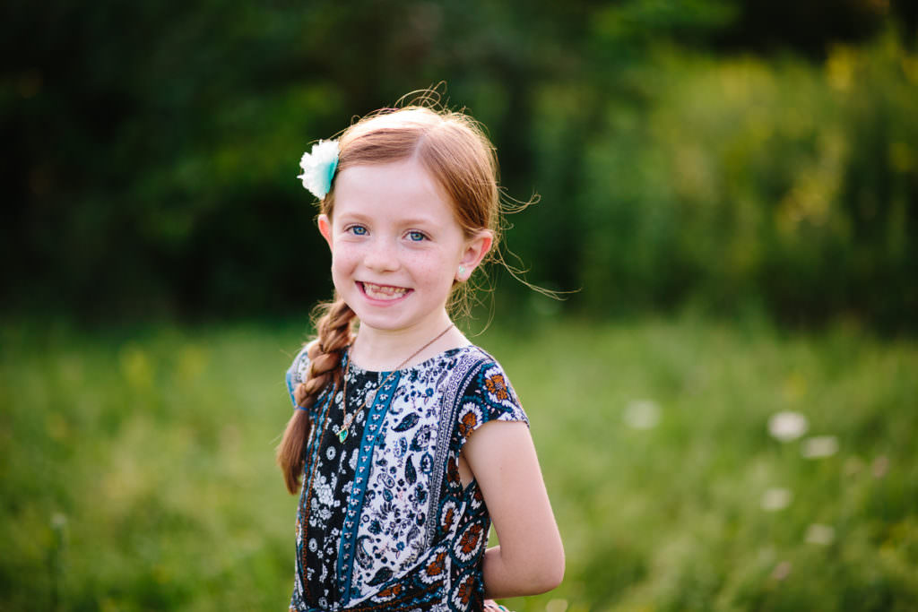 young girl with red hair and blued dress