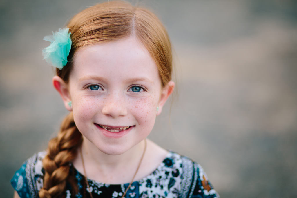red haired girl with braid and blue eyes