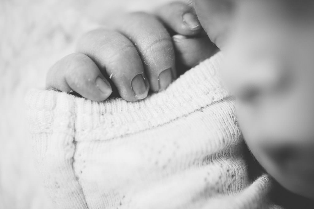 macro shot of newborn baby girl fingers