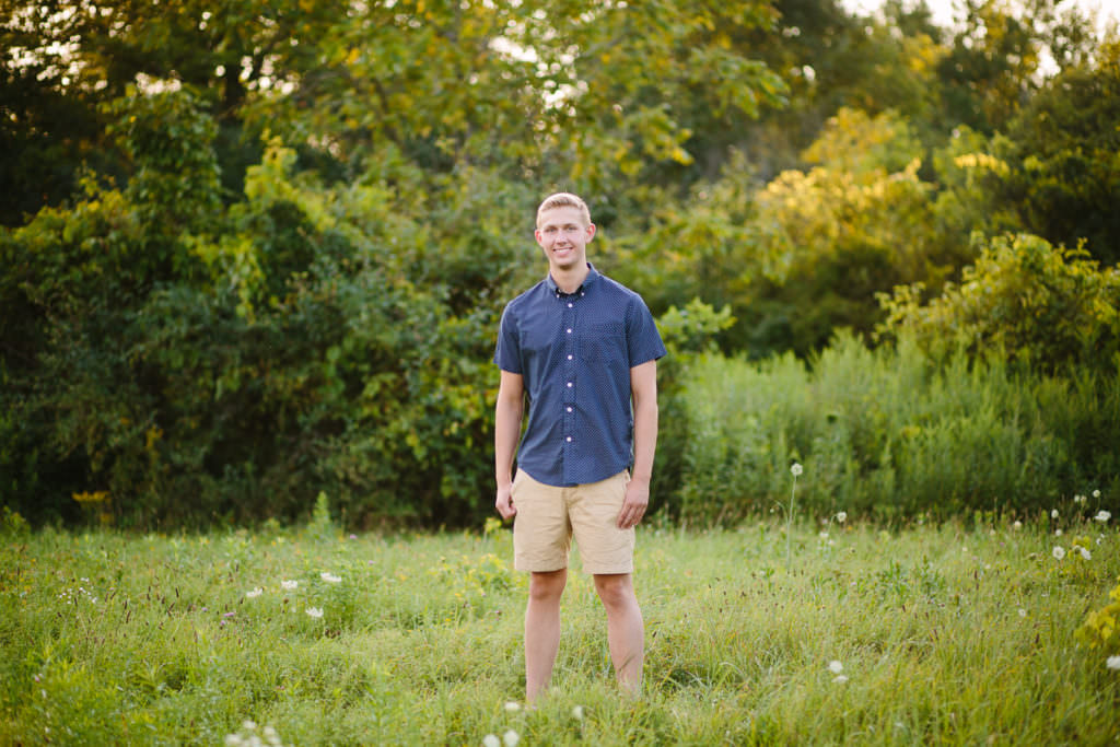 high school senior boy in blue shirt