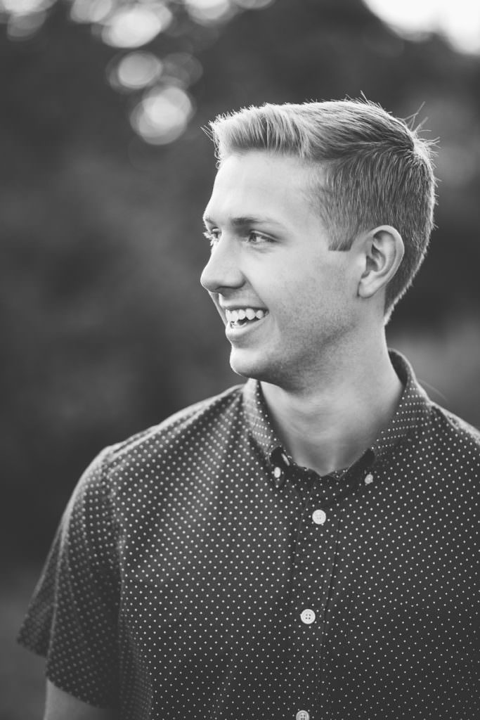 senior boy smiling and looking to the left