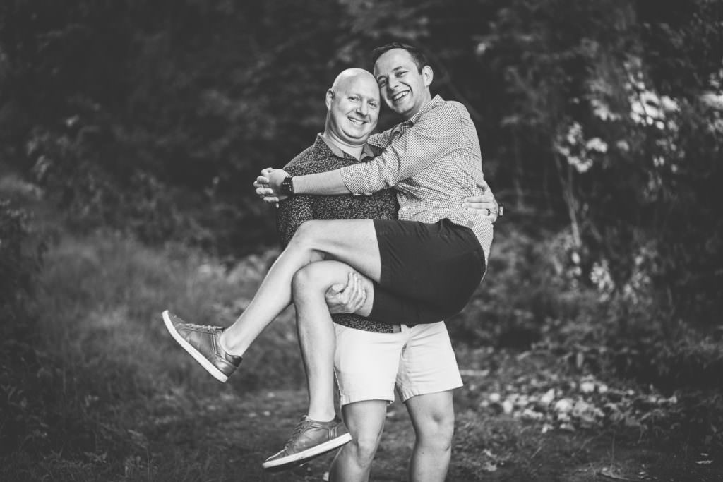 man holding his husband in arms