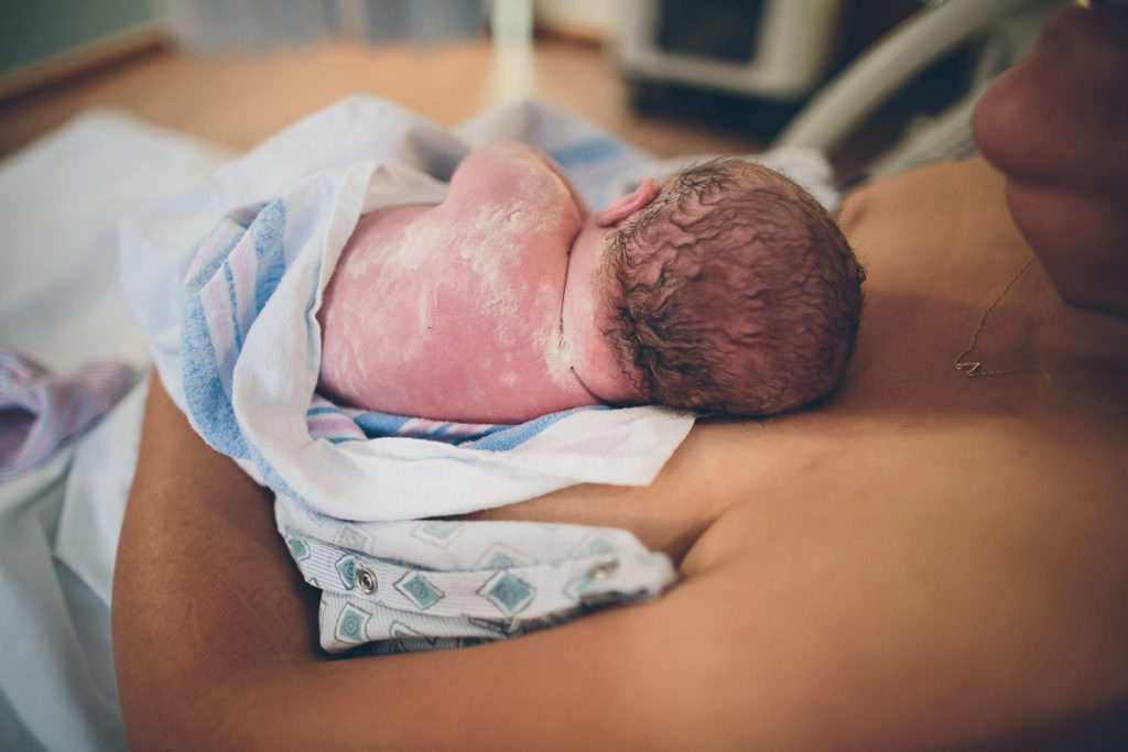 baby back right after birth covered in vernix