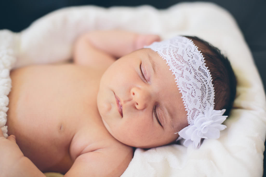 sleeping newborn baby girl white headband