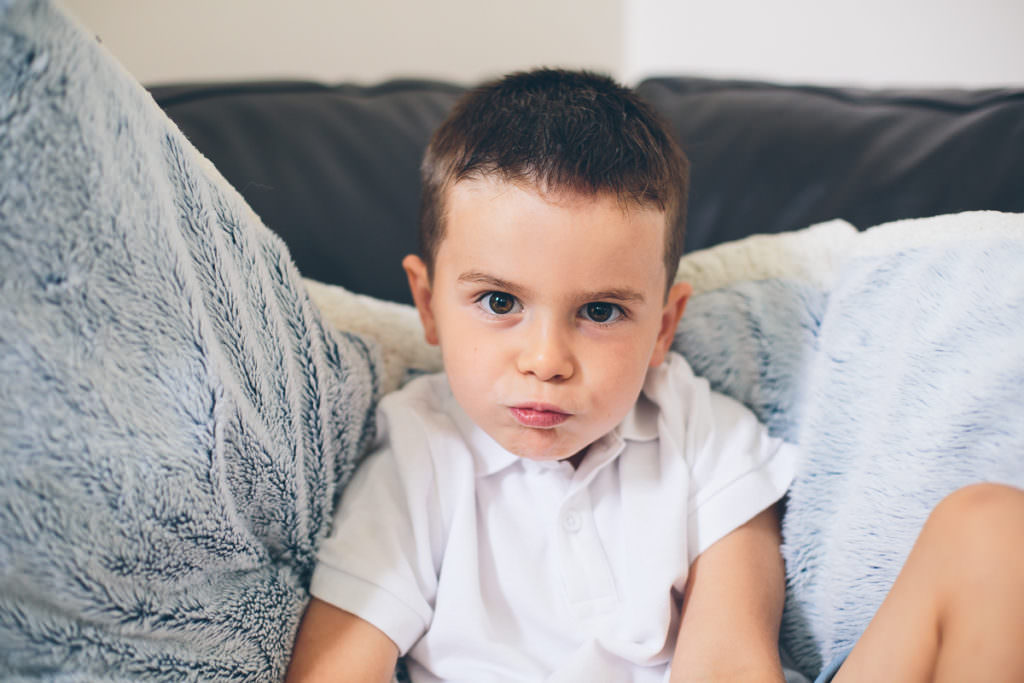 little boy showing angry face