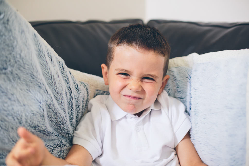 little boy showing his nervous face