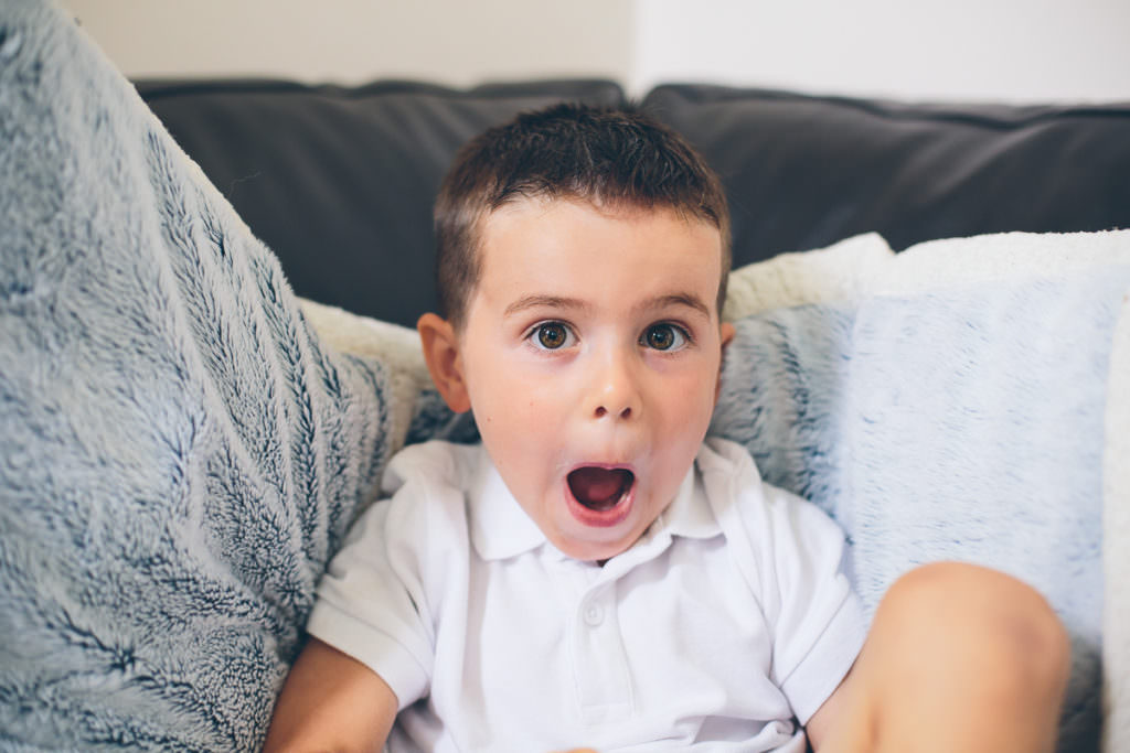 little boy showing an excited face